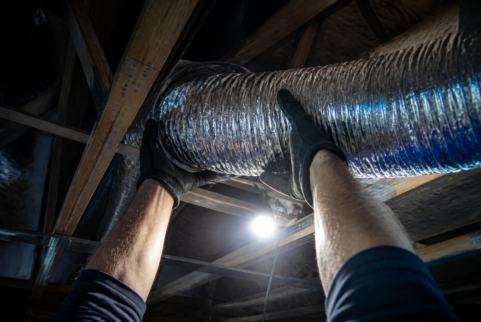 Australian HVAC technician servicing a ducted air conditioning system